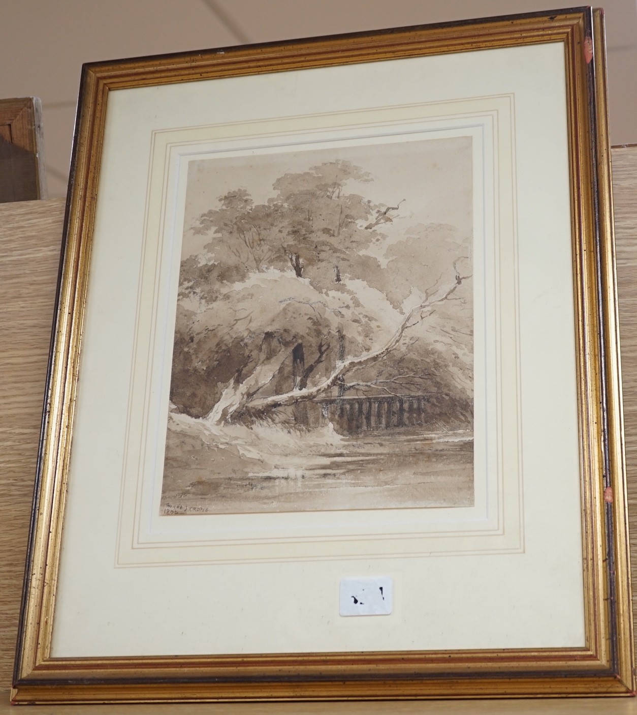 Circle of John Crome (1768-1821), monochrome watercolour, Trees beside a river, bears signature and dated 1806, 24 x 20cm